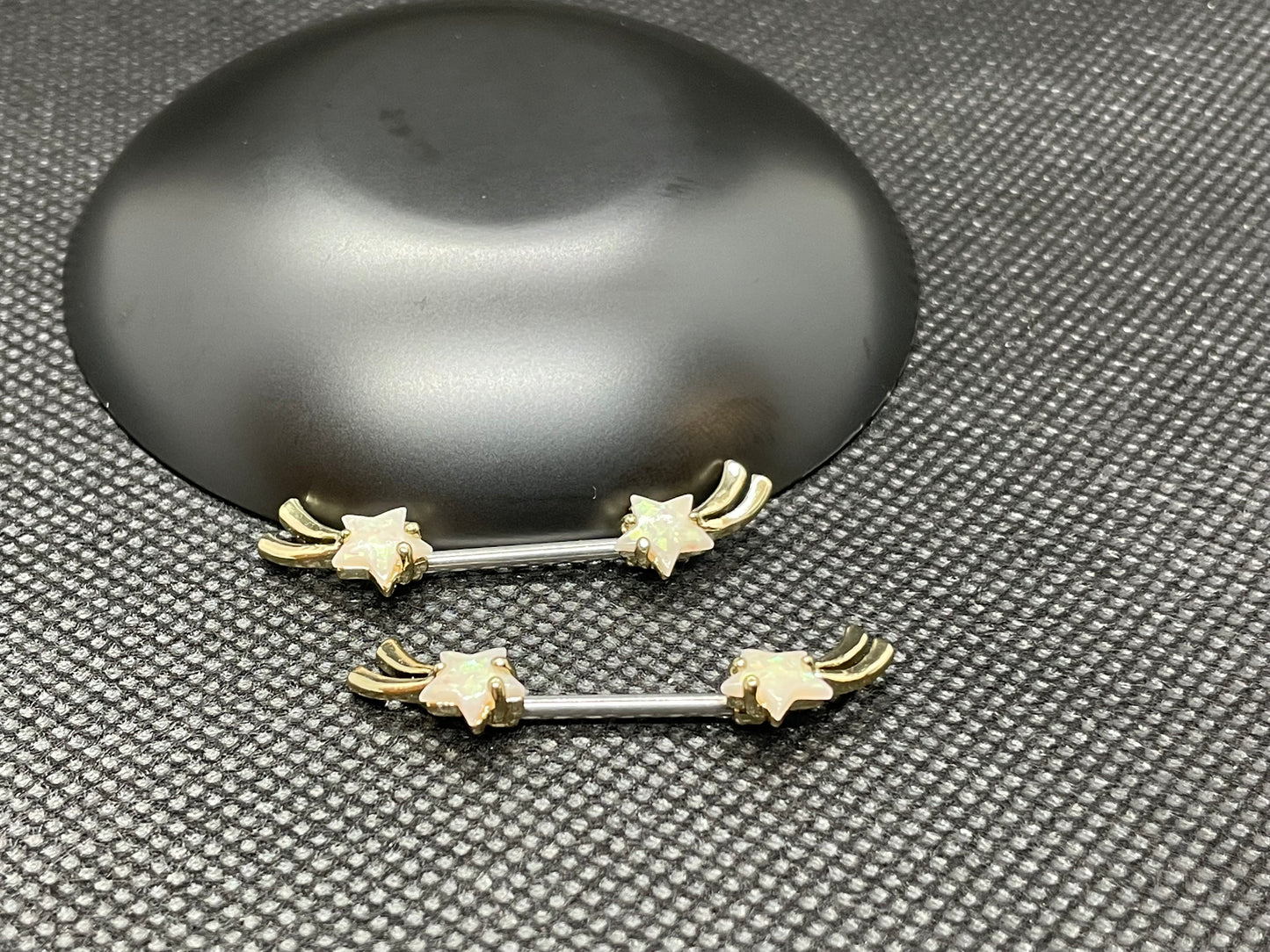 pair of shooting star nipple rings